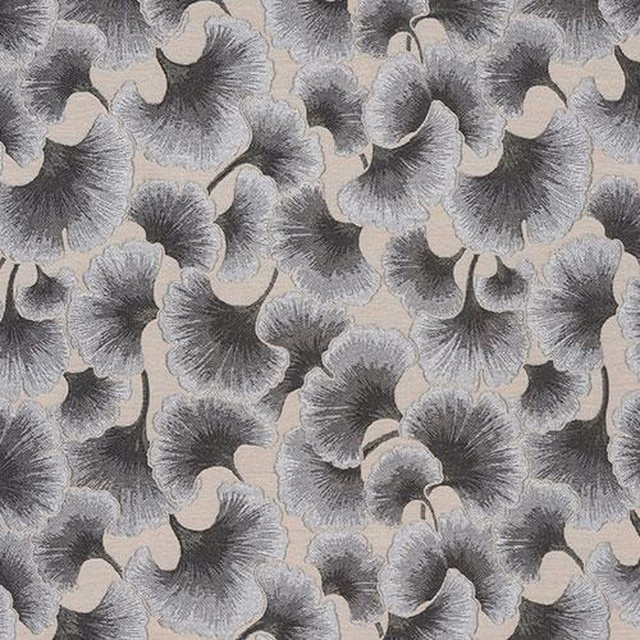 Close-up of gingko leaf pattern in soft dove and charcoal greys on a pale neutral ground