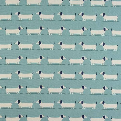 Repeated dachshund motif on soft duck egg blue cotton with navy and white dogs