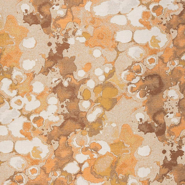 Abstract burnt orange, ochre and cream patterned fabric with soft textured ground