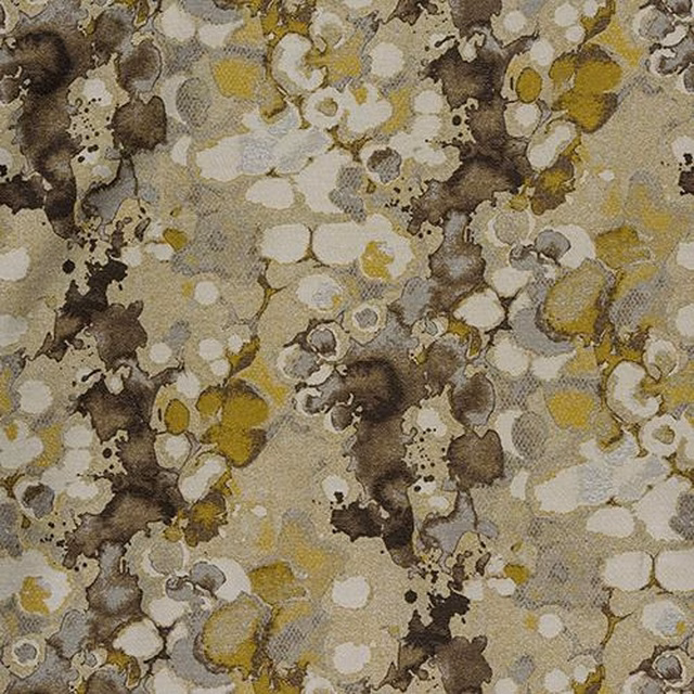 Abstract ochre and ivory patterned fabric with brown mottled accents and textured weave