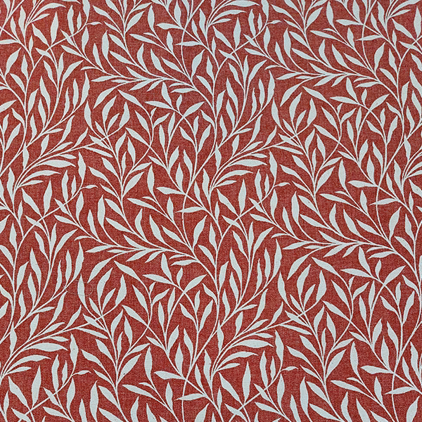 Russet red fabric swatch with trailing ivory leaf pattern