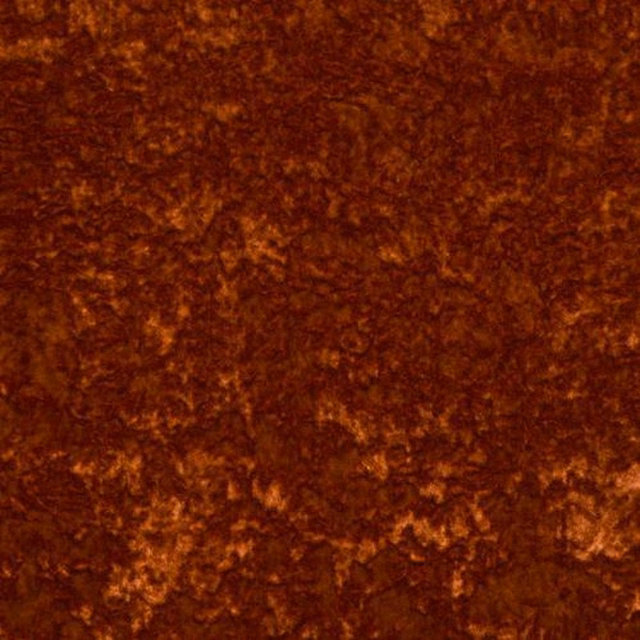 Close-up of deep burnt-orange velour with mottled russet highlights