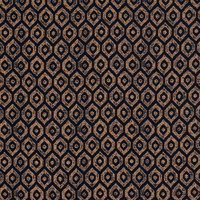 Close-up of deep indigo geometric fabric with small metallic lozenge motifs