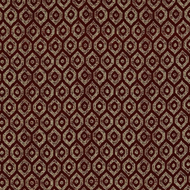 Deep burgundy fabric with small geometric diamond motifs and subtle metallic detailing