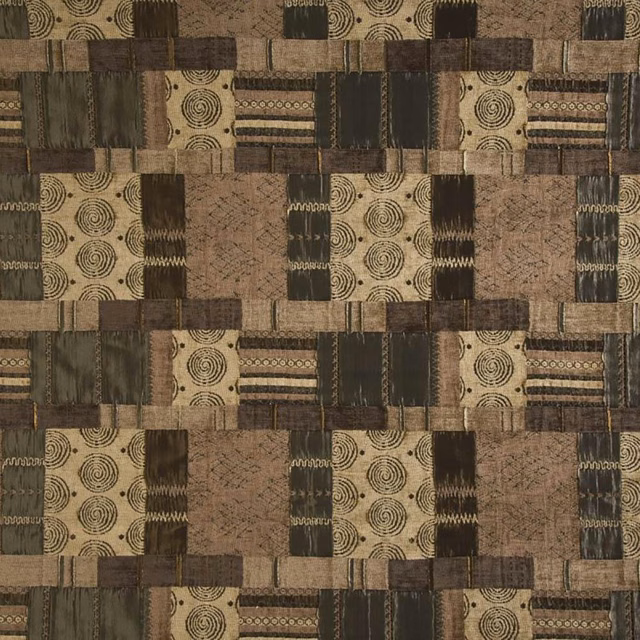 Patchwork geometric fabric swatch in muted olive, tan and dark brown
