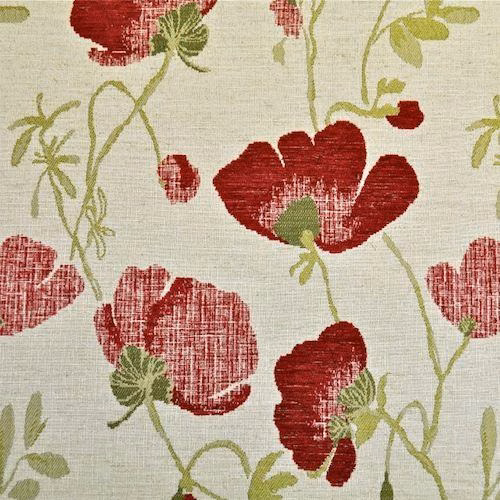 Red and green floral fabric on a pale woven ground
