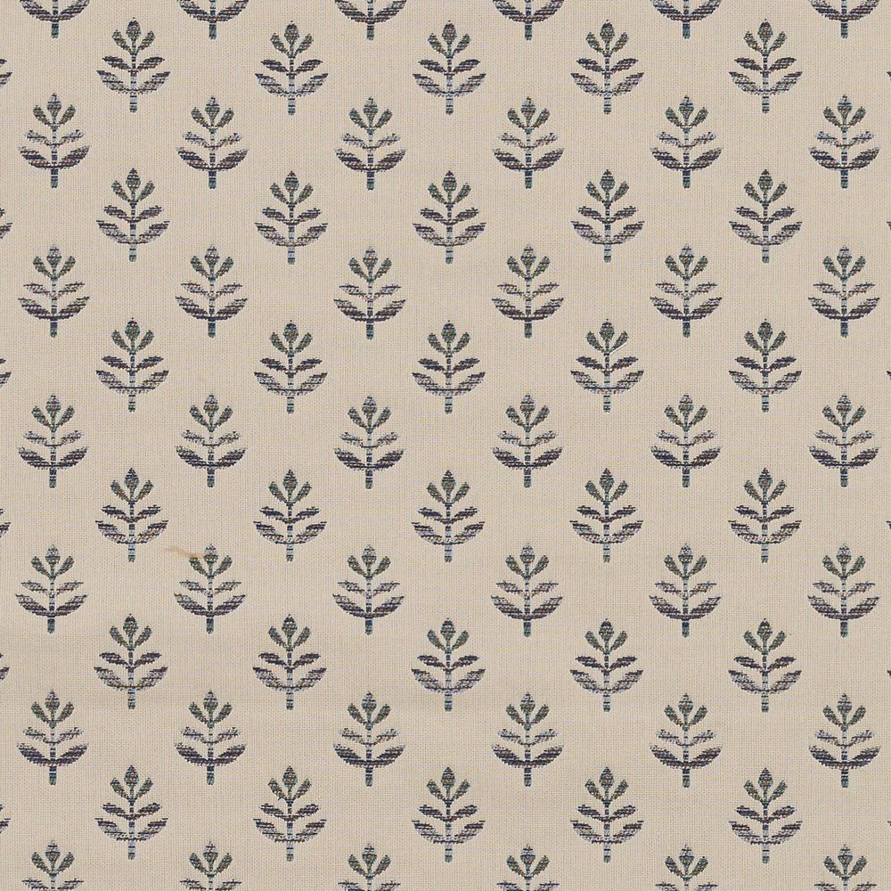 Small navy botanical motif on a pale woven fabric ground