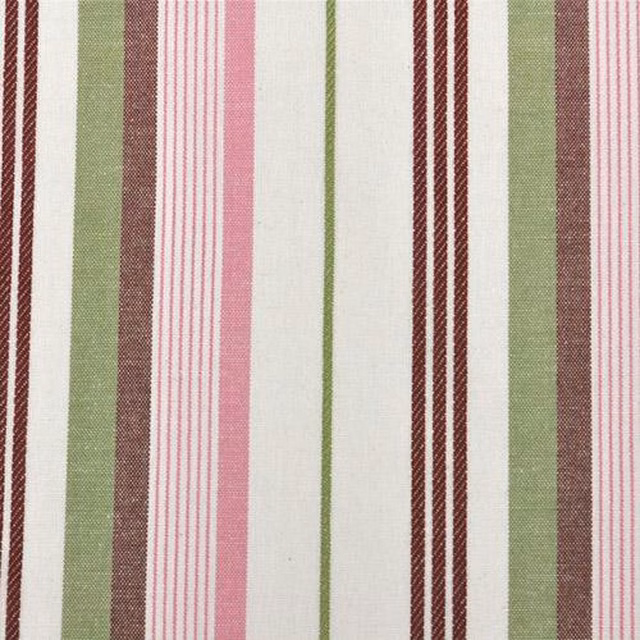Vertical pink, green and burgundy stripes on an off-white cotton swatch