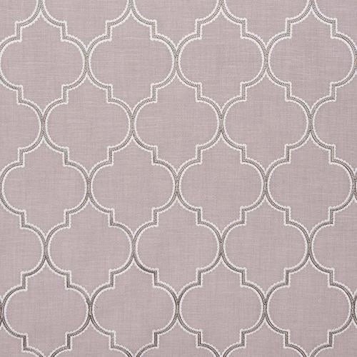 Soft blush pink woven fabric with pale scalloped geometric trellis pattern