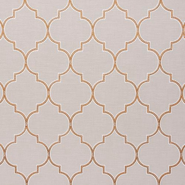 Pale woven fabric with a burnt orange quatrefoil trellis pattern
