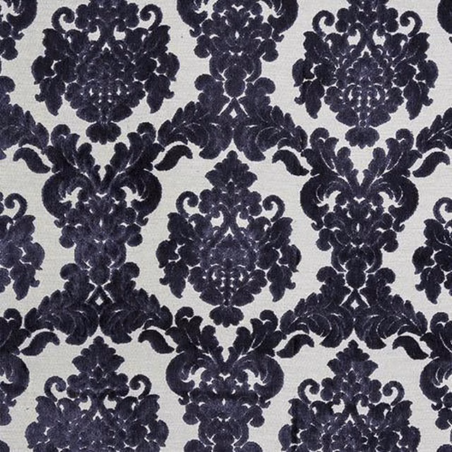 Dark aubergine damask motif on a pale textured ground
