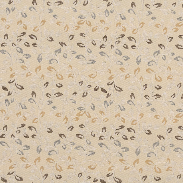 Close-up of cream woven fabric with small leaf motifs in taupe, grey and caramel
