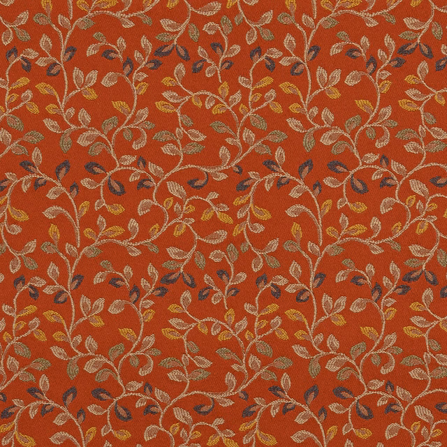Terracotta woven fabric with trailing leaf motif in cream, gold and navy
