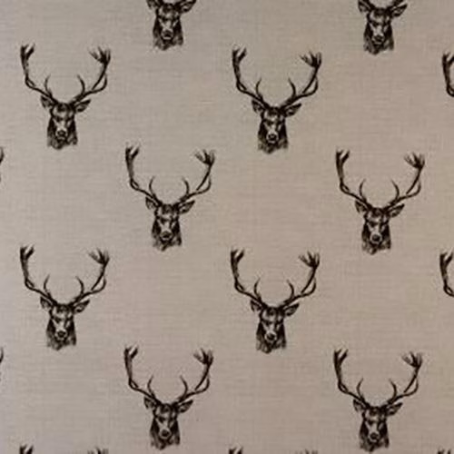 Charcoal stag head motif on pale grey cotton fabric swatch