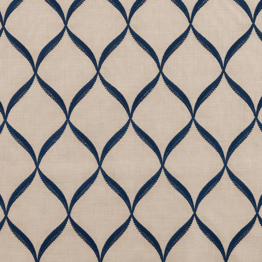 Blue indigo lattice pattern on a pale woven fabric background