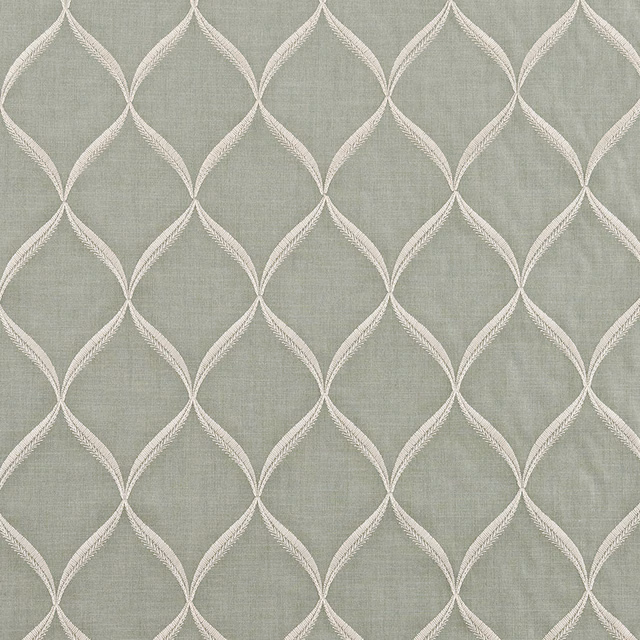 Soft verdigris green fabric with ivory looping diamond lattice