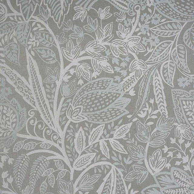 Duck egg blue woven fabric with a large leafy botanical pattern in pale tonal threads