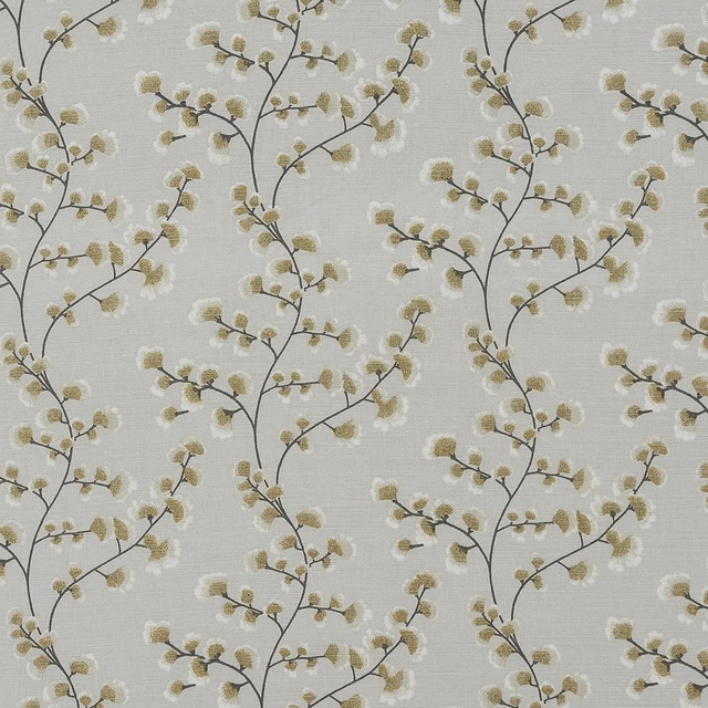 Ochre blossom branch cotton fabric on an ivory textured ground