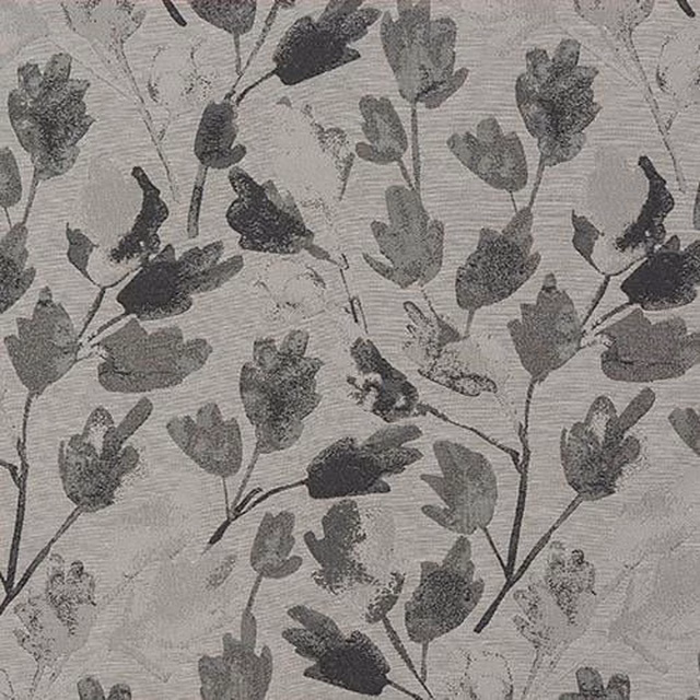 Close-up of charcoal grey leaf motif on a pale woven fabric