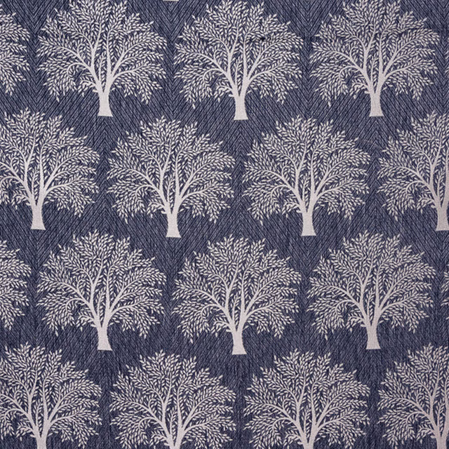 Indigo woven fabric with repeating pale tree motif and textured ground