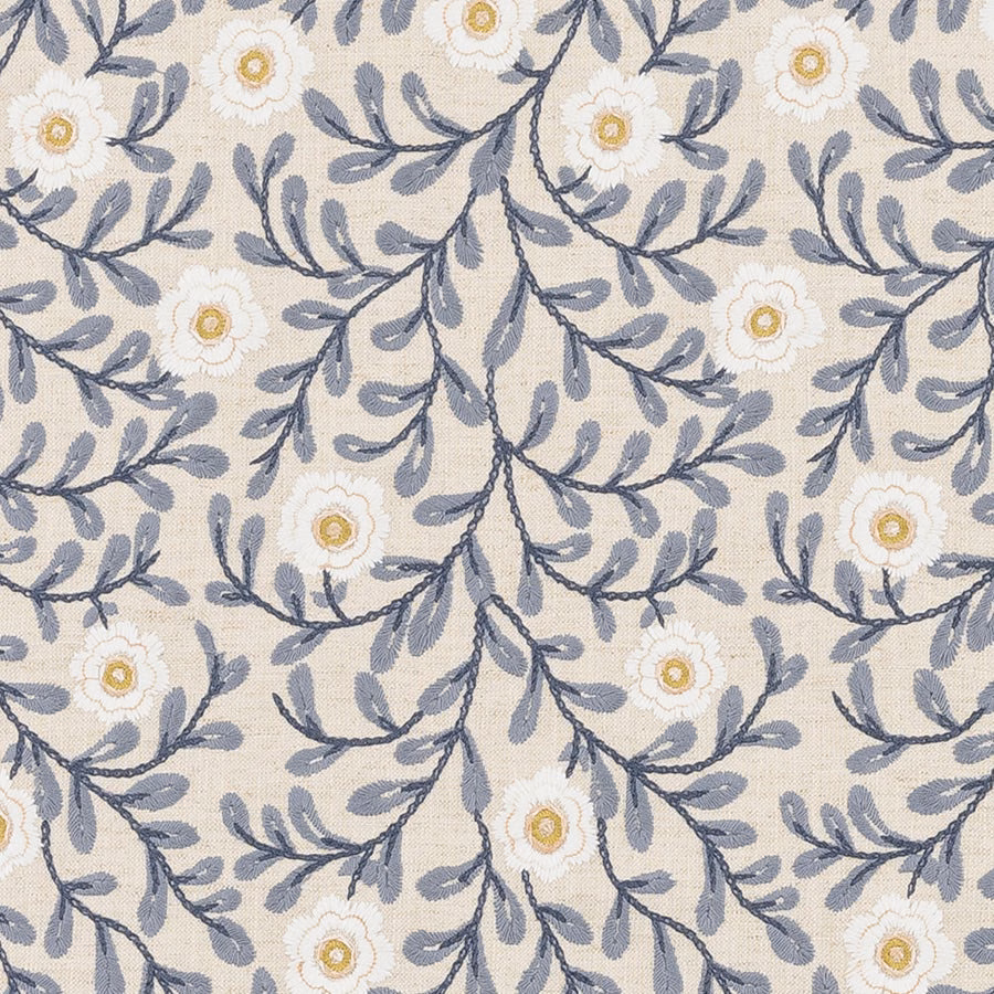 Blue-grey trailing floral fabric with white blooms and gold centres on a pale ground