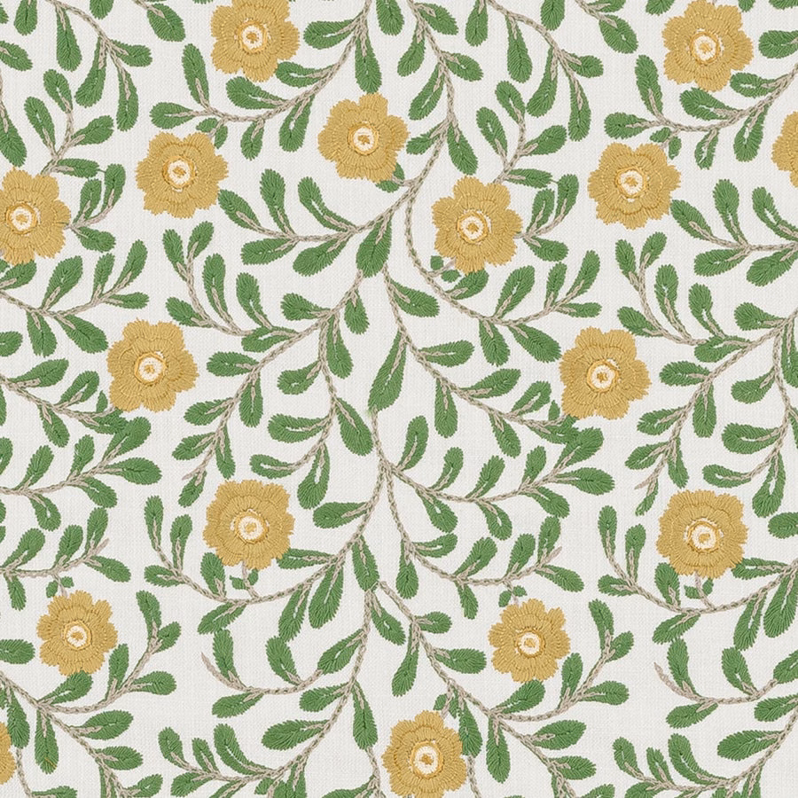 Embroidered floral fabric with jade green leaves and soft gold blooms on a pale ground