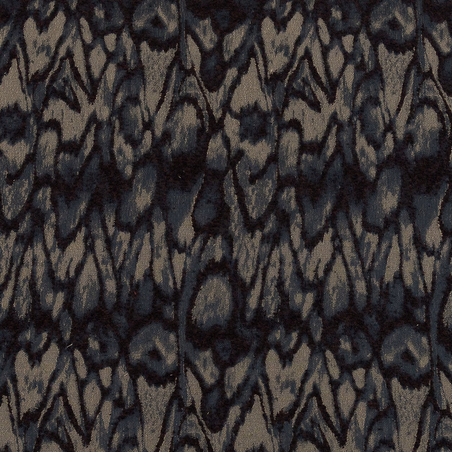 Close-up of abstract woven fabric with inky blue and taupe pattern