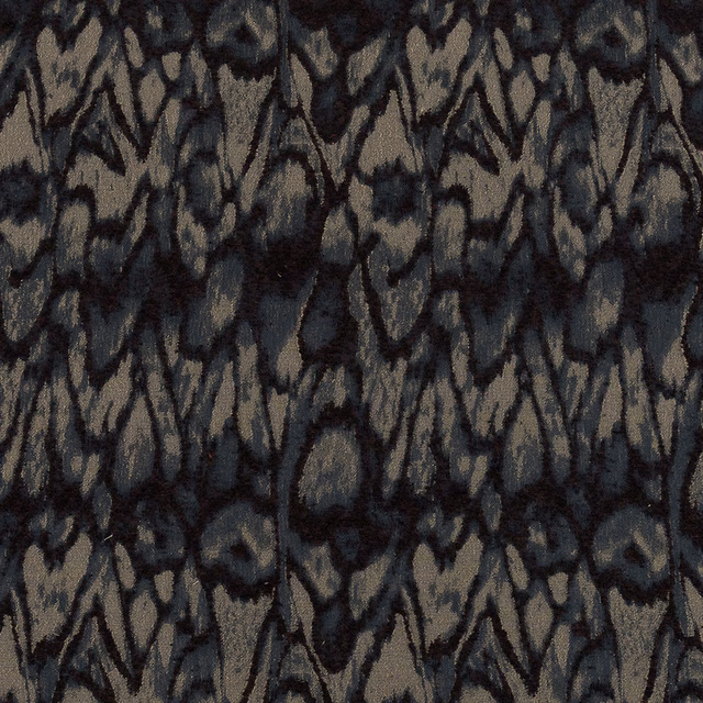 Close-up of abstract woven fabric with inky blue and taupe pattern
