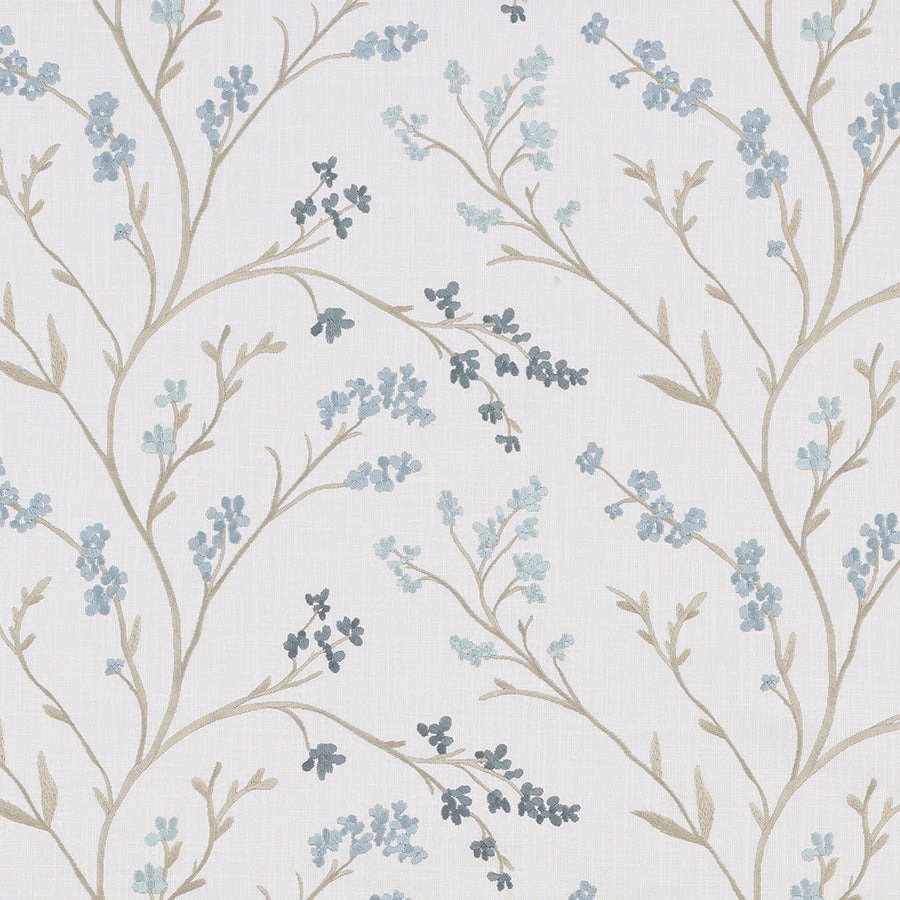 Pale botanical fabric with beige branches and soft seafoam blue leaf clusters