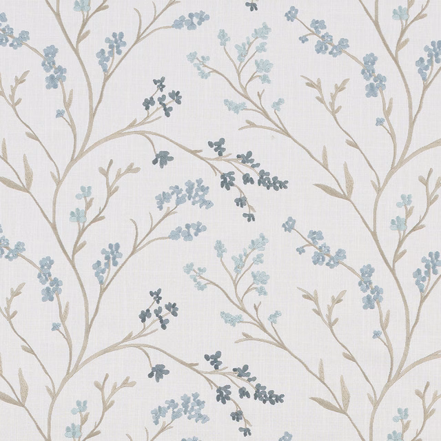 Pale botanical fabric with beige branches and soft seafoam blue leaf clusters
