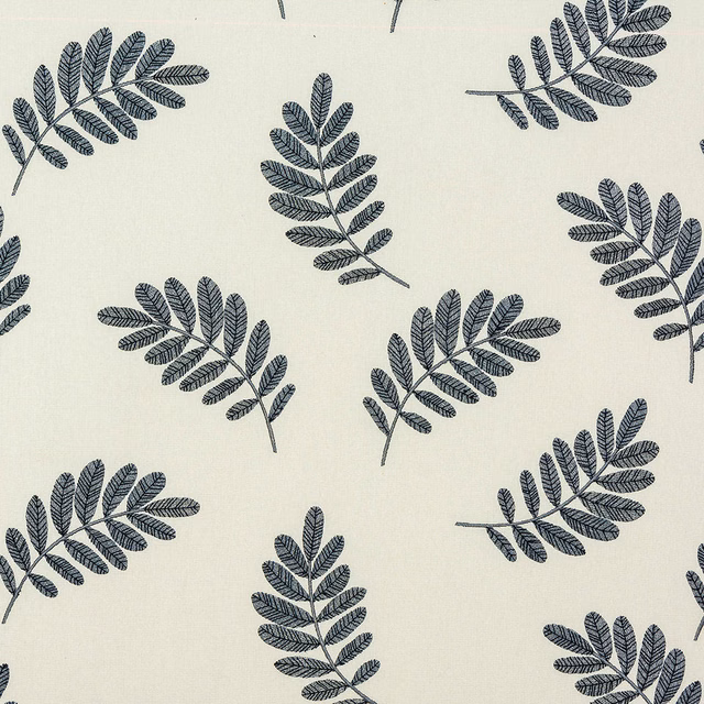 Cream cotton fabric with scattered slate-blue botanical leaf sprigs