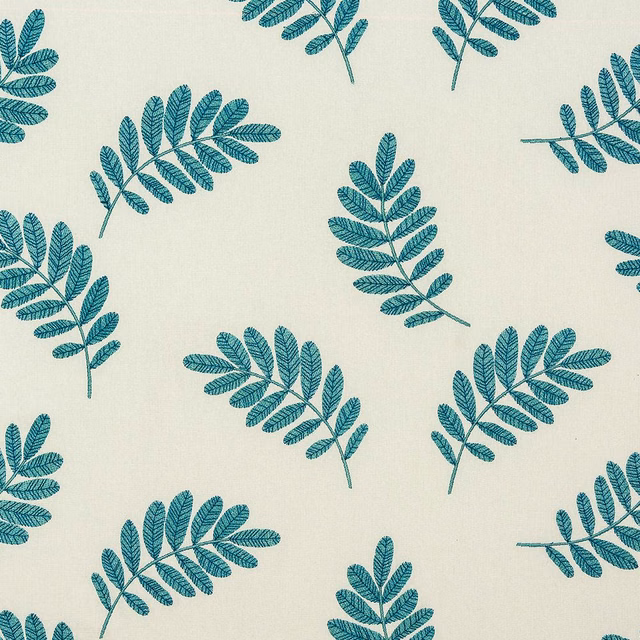 Cream fabric with scattered teal botanical leaf sprigs and fine lined detailing