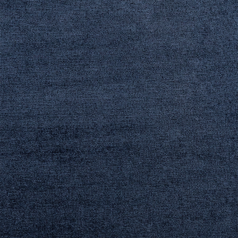 Close-up of a deep indigo blue plain weave fabric with a subtle matte texture