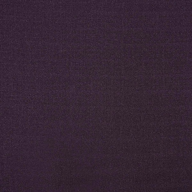 Close-up of deep aubergine purple plain woven fabric with a fine texture