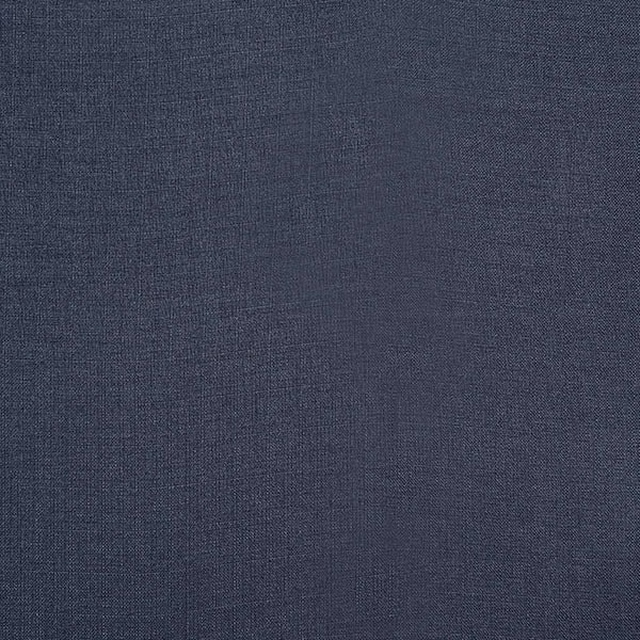 Close-up of deep indigo plain woven fabric with fine textured surface