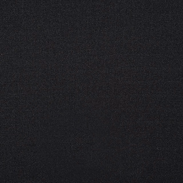 Close-up of deep charcoal black plain woven fabric with a fine texture