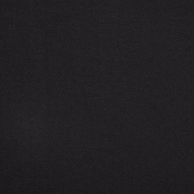 Close-up of deep charcoal-grey woven fabric with a fine matte texture