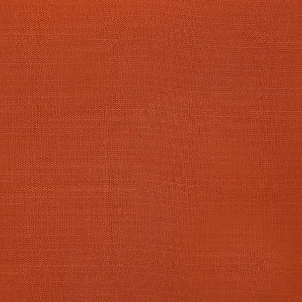 Warm terracotta plain woven fabric swatch with fine textured surface