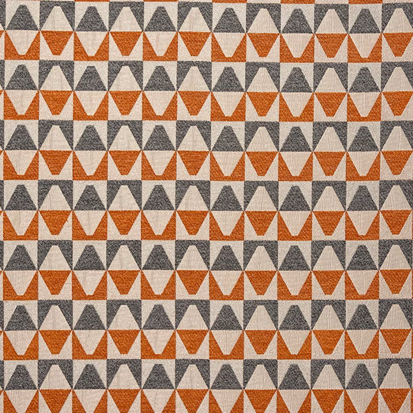Geometric cotton fabric with burnt orange and charcoal triangular motifs on a pale ground