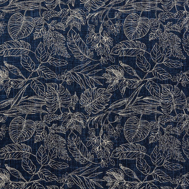 Indigo botanical fabric with pale leaf outlines and textured woven ground