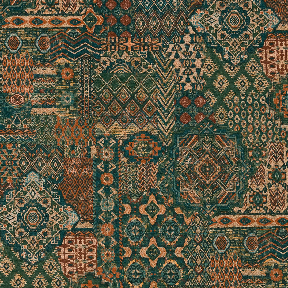 Patchwork-style patterned fabric in deep jade green with terracotta and cream motifs