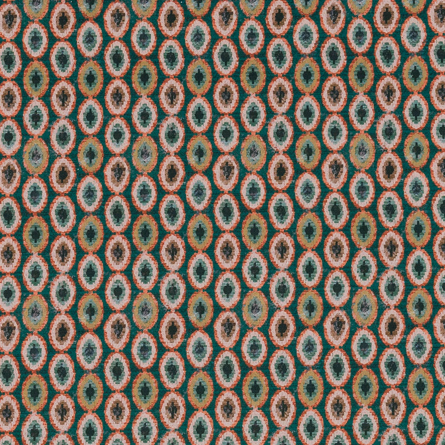 Close-up of Shiraz Jade fabric showing small teal and coral oval motifs on a textured ground.