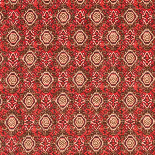Close-up of Tabriz Rosso fabric showing red geometric medallions with beige and brown details