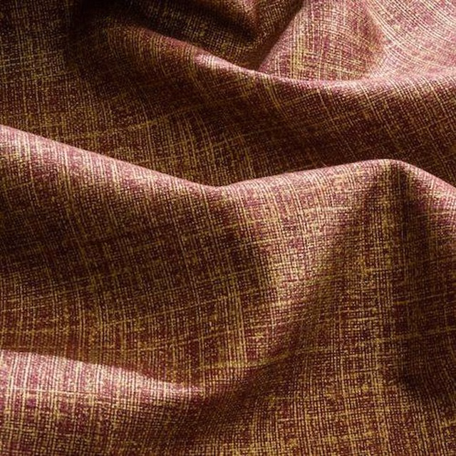 Deep bordeaux woven fabric with fine gold crosshatch texture and soft folded drape
