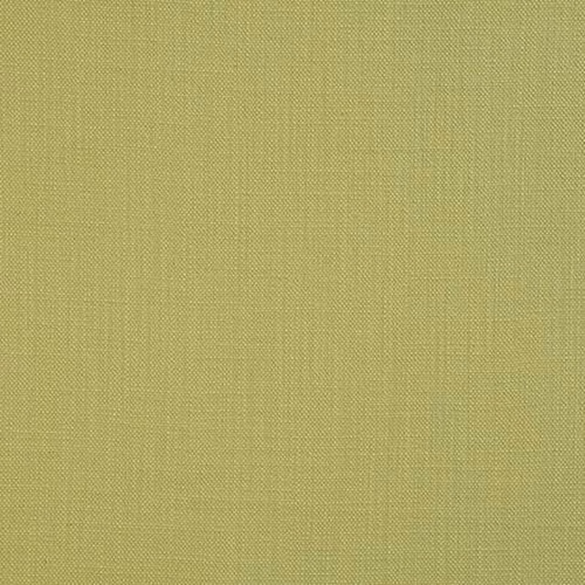 Close-up of fresh apple green plain cotton fabric with fine woven texture