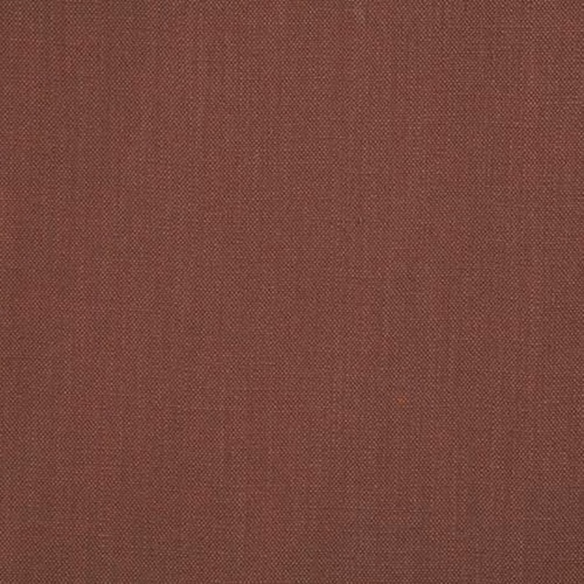 Close-up of a muted truffle red plain woven cotton fabric