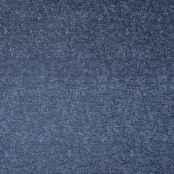 Close-up of muted indigo blue textured fabric with fine mottled weave
