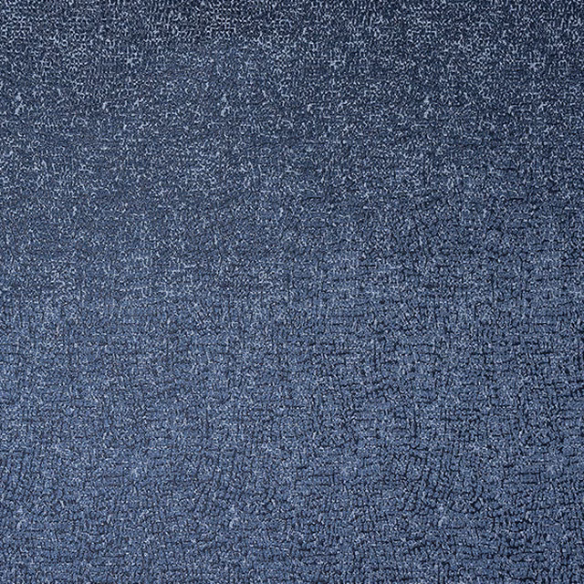Close-up of muted indigo blue textured fabric with fine mottled weave