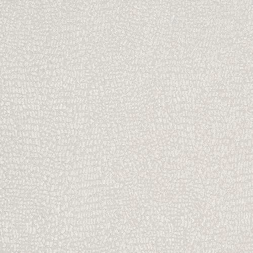 Close-up of pale ivory woven fabric with a softly textured, mottled surface