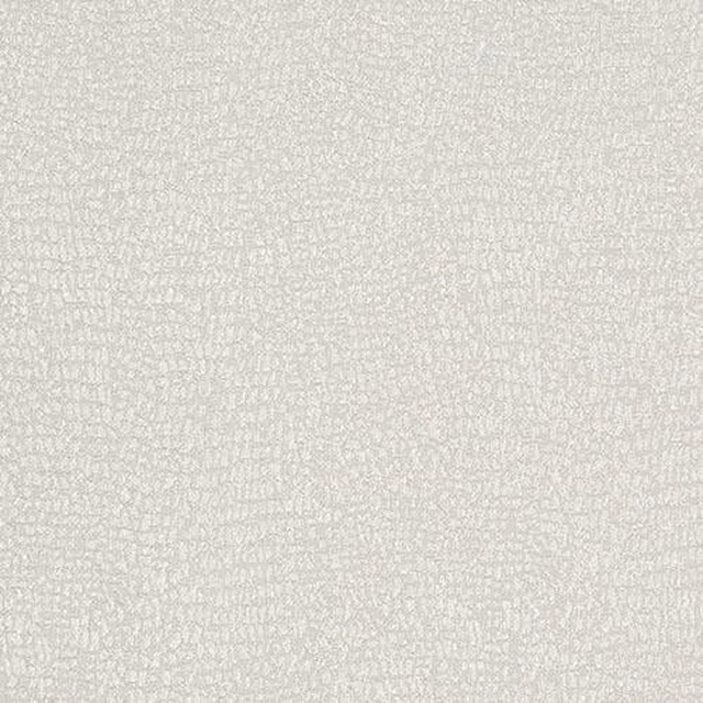 Close-up of pale ivory woven fabric with a softly textured, mottled surface